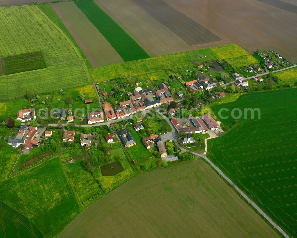 Wetzdorf from above - Agricultural land and field boundaries surround the settlement area of the village in Wetzdorf in the state Thuringia, Germany