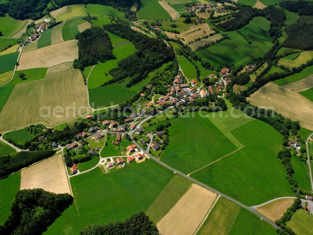 Aerial image Wetzelsberg - Agricultural land and field boundaries surround the settlement area of the village in Wetzelsberg in the state Bavaria, Germany