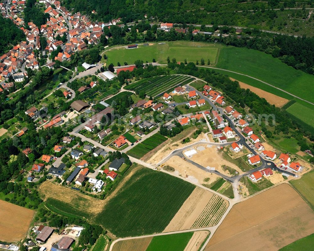 Widdern from above - Agricultural land and field boundaries surround the settlement area of the village in Widdern in the state Baden-Wuerttemberg, Germany