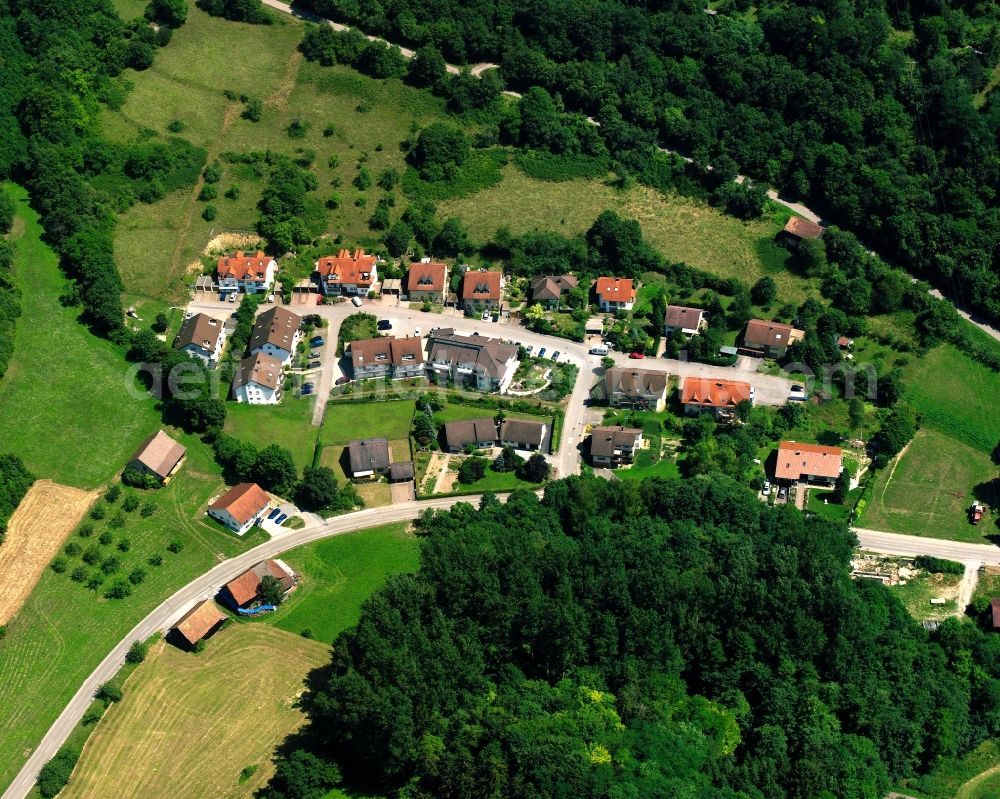 Widdern from the bird's eye view: Agricultural land and field boundaries surround the settlement area of the village in Widdern in the state Baden-Wuerttemberg, Germany