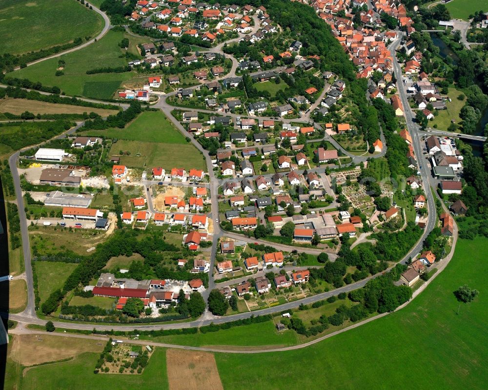 Widdern from above - Agricultural land and field boundaries surround the settlement area of the village in Widdern in the state Baden-Wuerttemberg, Germany