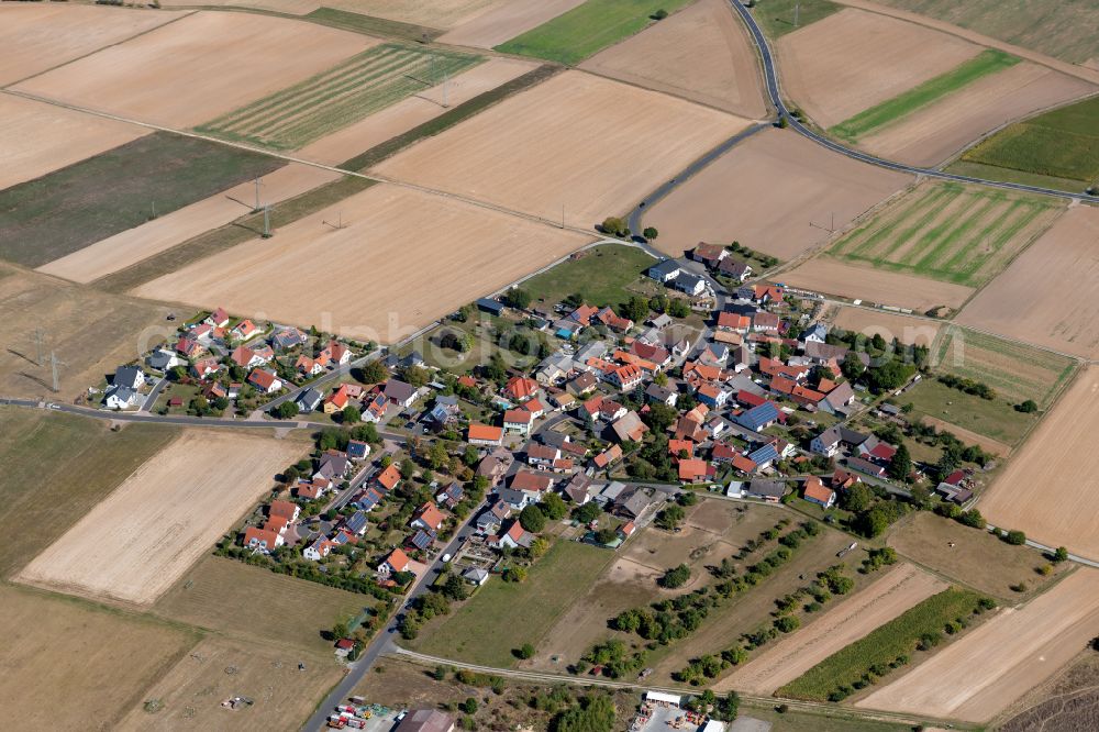 Wiebelbach from above - Agricultural land and field boundaries surround the settlement area of the village in Wiebelbach in the state Bavaria, Germany