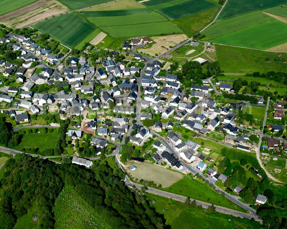 Wiebelsheim from above - Agricultural land and field boundaries surround the settlement area of the village in Wiebelsheim in the state Rhineland-Palatinate, Germany