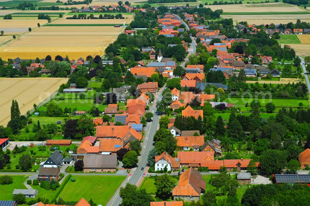 Wiedensahl Flecken from the bird's eye view: Agricultural land and field boundaries surround the settlement area of the village in Wiedensahl Flecken in the state Lower Saxony, Germany