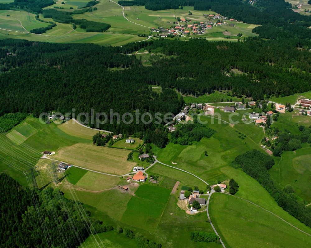 Wieladingen from above - Agricultural land and field boundaries surround the settlement area of the village in Wieladingen in the state Baden-Wuerttemberg, Germany