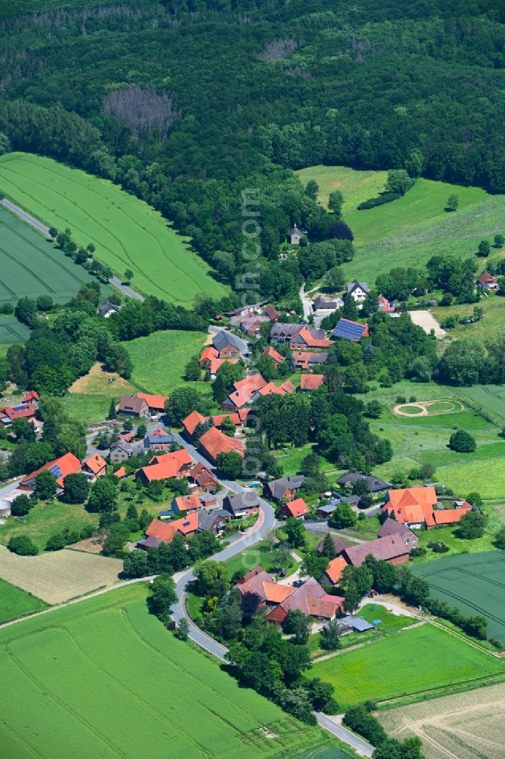 Wiersen from the bird's eye view: Agricultural land and field boundaries surround the settlement area of the village in Wiersen in the state Lower Saxony, Germany