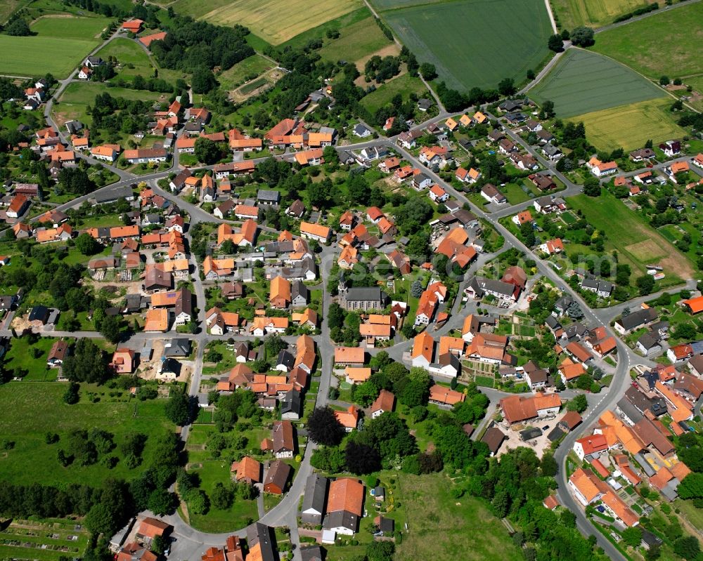 Wiershausen from the bird's eye view: Agricultural land and field boundaries surround the settlement area of the village in Wiershausen in the state Lower Saxony, Germany