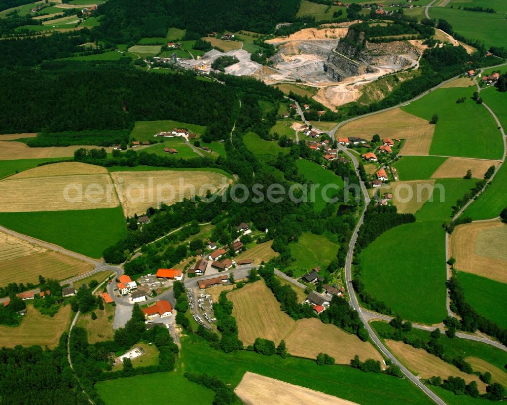 Wies from the bird's eye view: Agricultural land and field boundaries surround the settlement area of the village in Wies in the state Bavaria, Germany