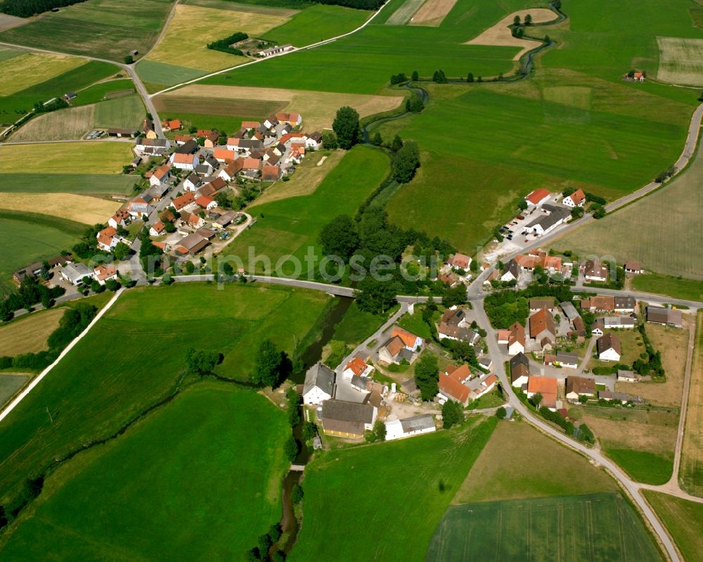 Wiesethbruck from the bird's eye view: Agricultural land and field boundaries surround the settlement area of the village in Wiesethbruck in the state Bavaria, Germany