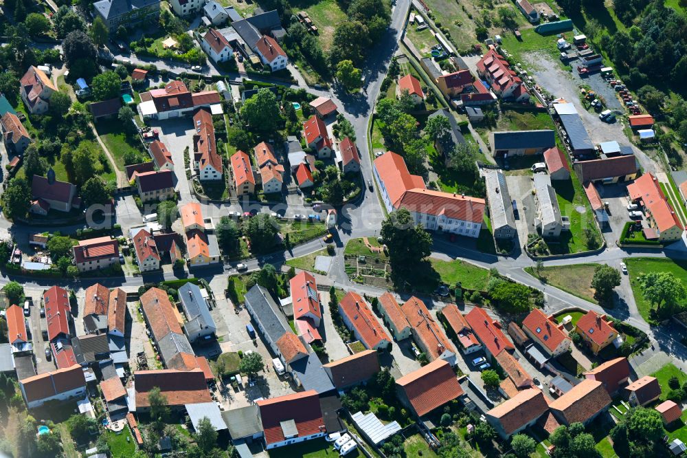 Aerial image Wilschdorf - Agricultural land and field boundaries surround the settlement area of the village on street Kirchstrasse in Wilschdorf in the state Saxony, Germany