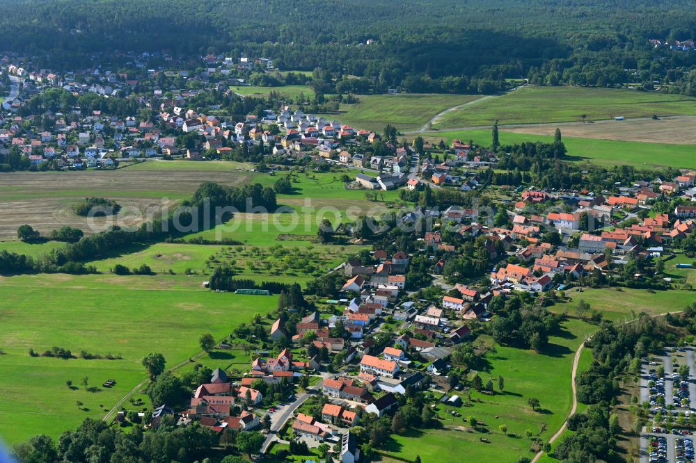 Wilschdorf from the bird's eye view: Agricultural land and field boundaries surround the settlement area of the village on street Kirchstrasse in Wilschdorf in the state Saxony, Germany