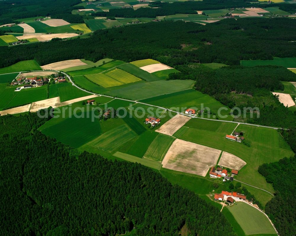 Windbaising from the bird's eye view: Agricultural land and field boundaries surround the settlement area of the village in Windbaising in the state Bavaria, Germany