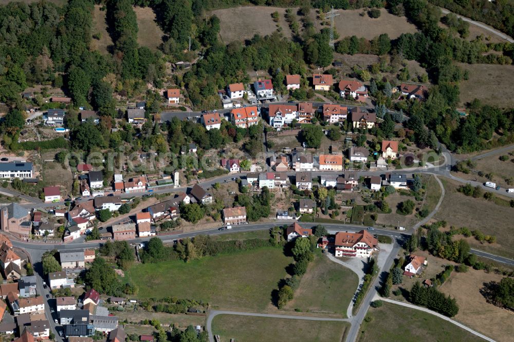 Aerial image Windheim - Agricultural land and field boundaries surround the settlement area of the village in Windheim in the state Bavaria, Germany