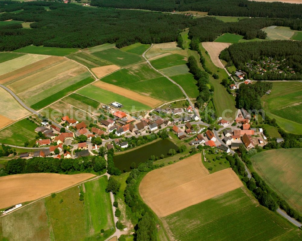 Winkelhaid from above - Agricultural land and field boundaries surround the settlement area of the village in Winkelhaid in the state Bavaria, Germany