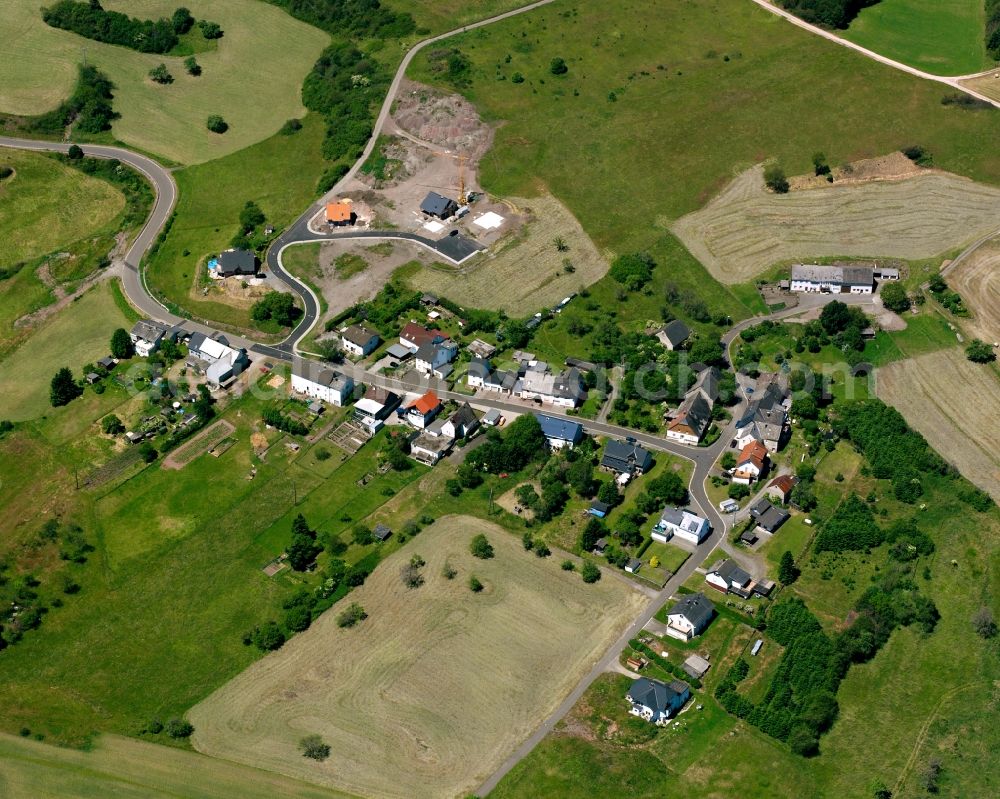 Winnenberg from above - Agricultural land and field boundaries surround the settlement area of the village in Winnenberg in the state Rhineland-Palatinate, Germany