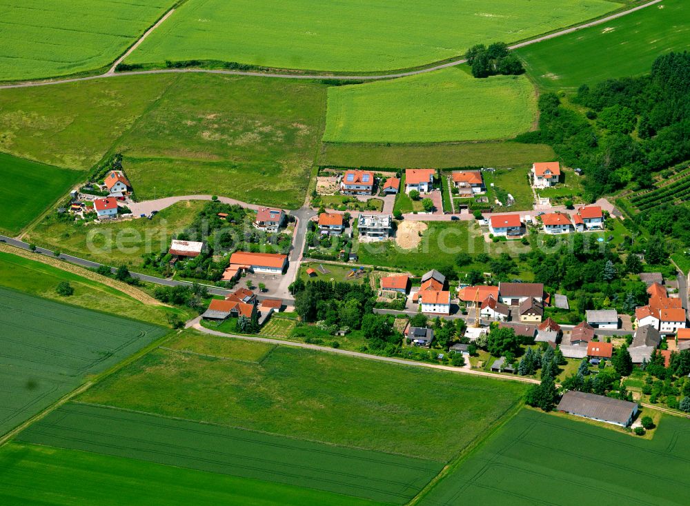 Winterborn from above - Agricultural land and field boundaries surround the settlement area of the village in Winterborn in the state Rhineland-Palatinate, Germany