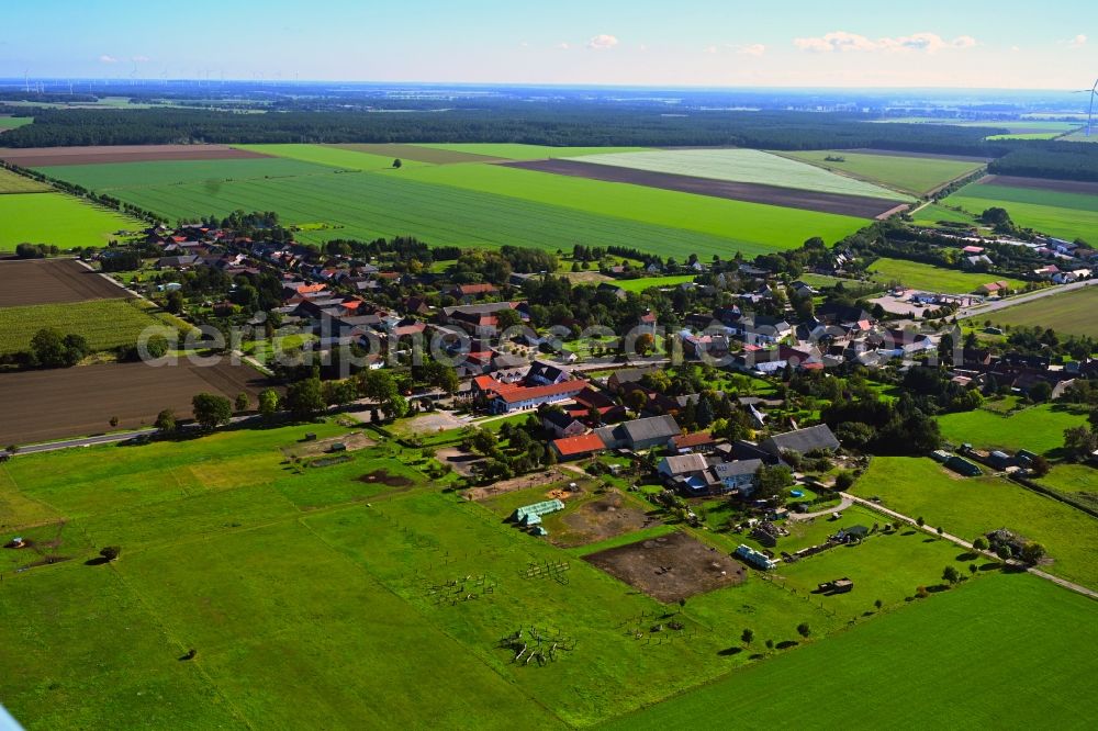 Winterfeld from the bird's eye view: Agricultural land and field boundaries surround the settlement area of the village in Winterfeld in the state Saxony-Anhalt, Germany