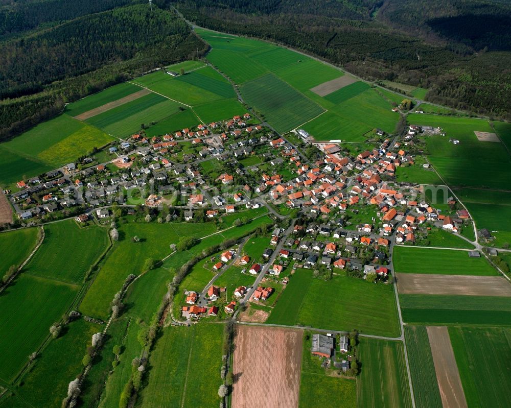 Aerial image Wippershain - Agricultural land and field boundaries surround the settlement area of the village in Wippershain in the state Hesse, Germany