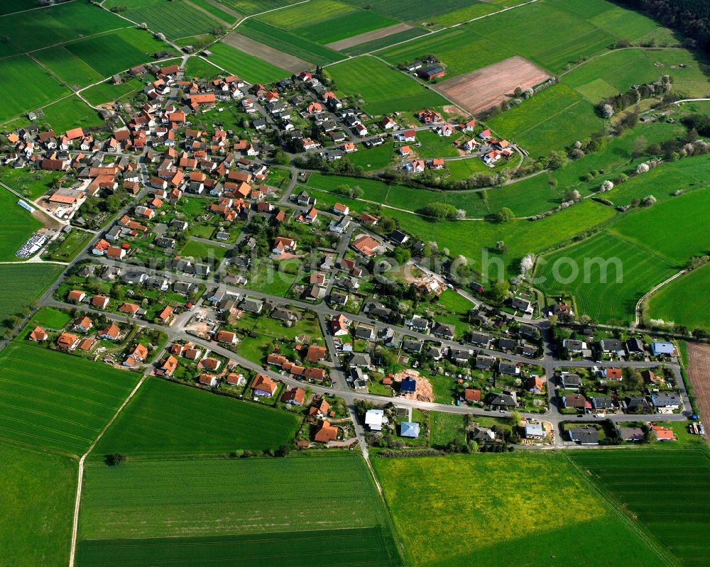 Aerial photograph Wippershain - Agricultural land and field boundaries surround the settlement area of the village in Wippershain in the state Hesse, Germany