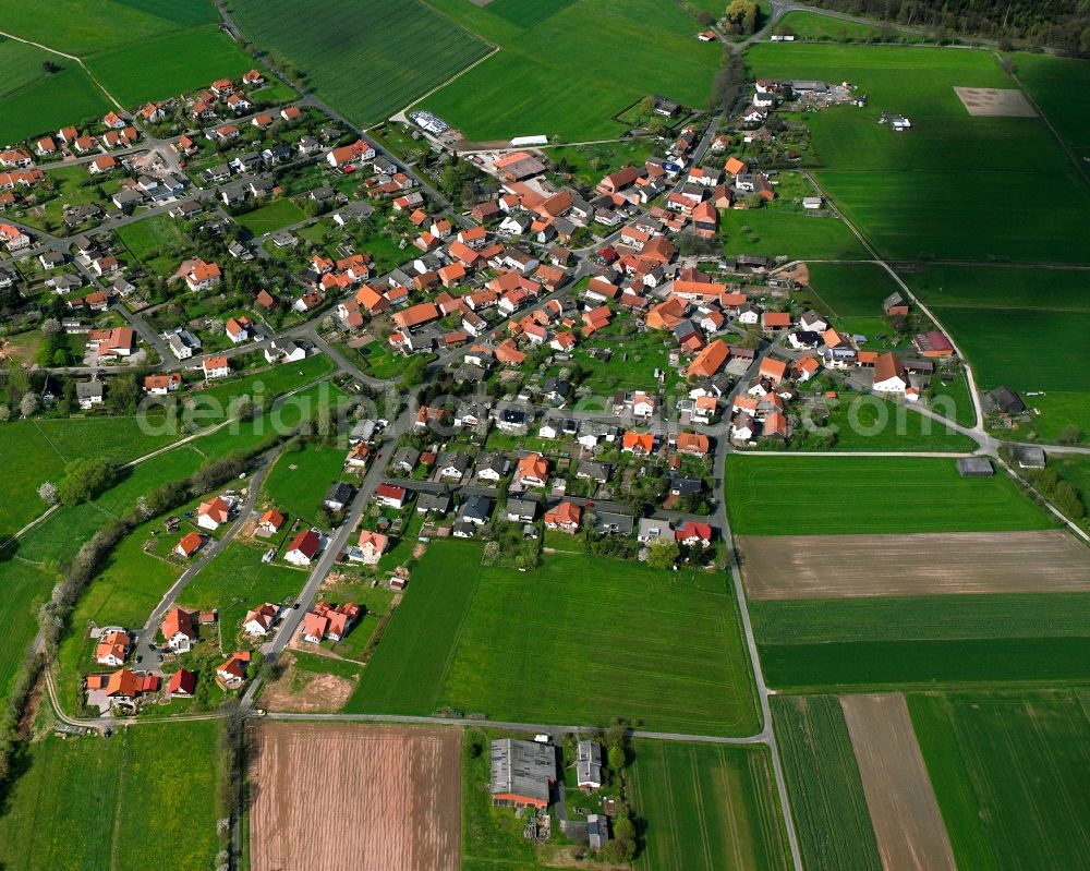 Wippershain from the bird's eye view: Agricultural land and field boundaries surround the settlement area of the village in Wippershain in the state Hesse, Germany