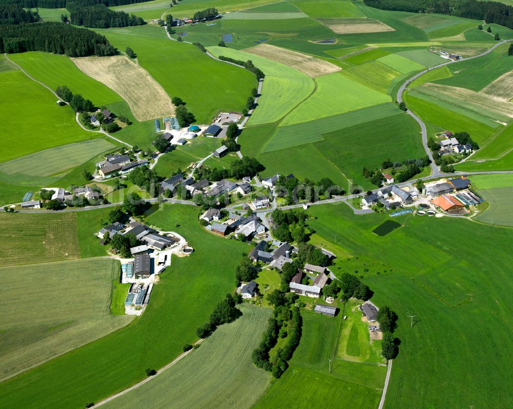 Aerial image Wölbersbach - Agricultural land and field boundaries surround the settlement area of the village in Wölbersbach in the state Bavaria, Germany