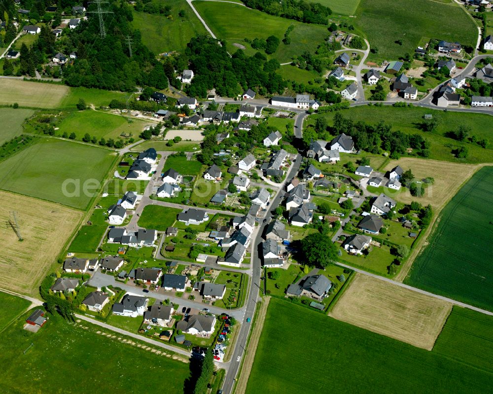 Wochenendhausgebiet Erbach from above - Agricultural land and field boundaries surround the settlement area of the village in Wochenendhausgebiet Erbach in the state Rhineland-Palatinate, Germany