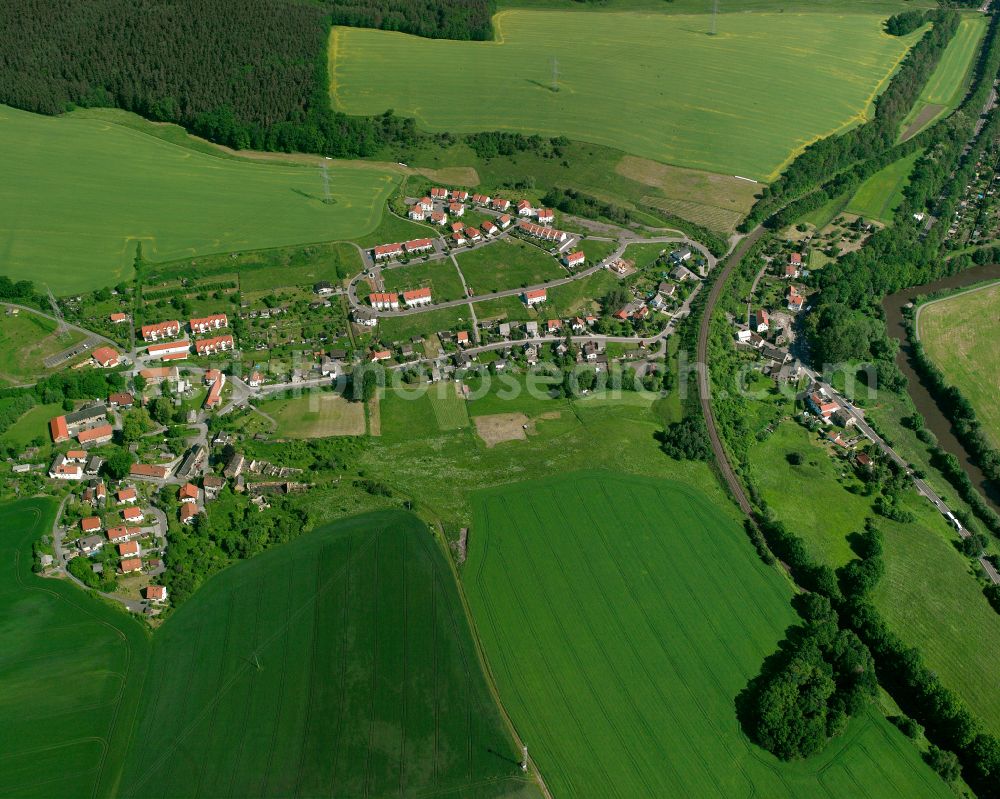 Aerial image Wolfsgefärth - Agricultural land and field boundaries surround the settlement area of the village in Wolfsgefärth in the state Thuringia, Germany