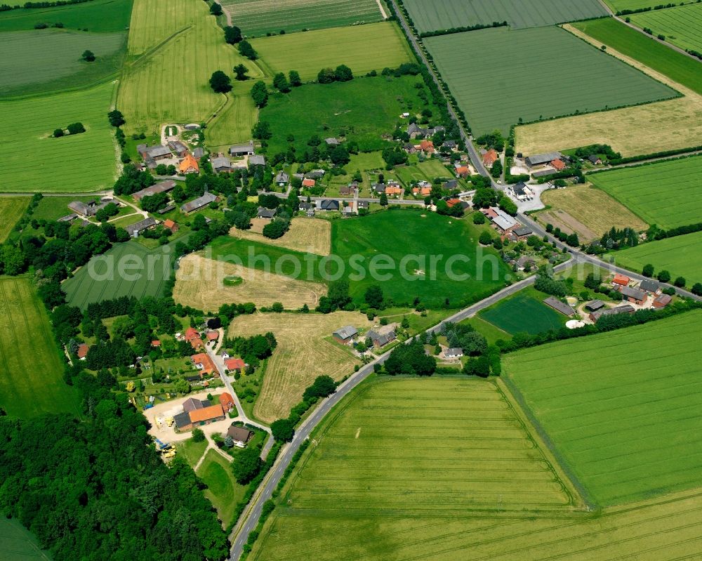 Aerial image Woltersdorf - Agricultural land and field boundaries surround the settlement area of the village in Woltersdorf in the state Schleswig-Holstein, Germany