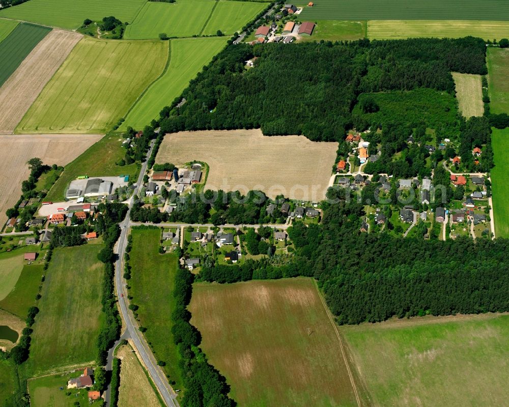 Aerial image Woltersdorf - Agricultural land and field boundaries surround the settlement area of the village in Woltersdorf in the state Schleswig-Holstein, Germany