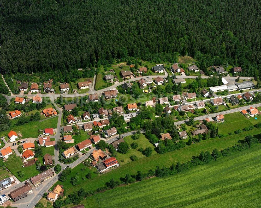 Würzbach from the bird's eye view: Agricultural land and field boundaries surround the settlement area of the village in Würzbach in the state Baden-Wuerttemberg, Germany