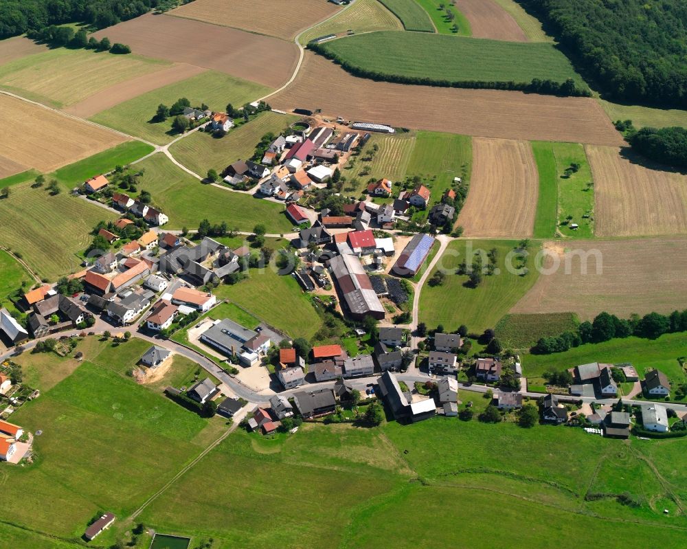 Aerial image Würzberg - Agricultural land and field boundaries surround the settlement area of the village in Würzberg in the state Hesse, Germany