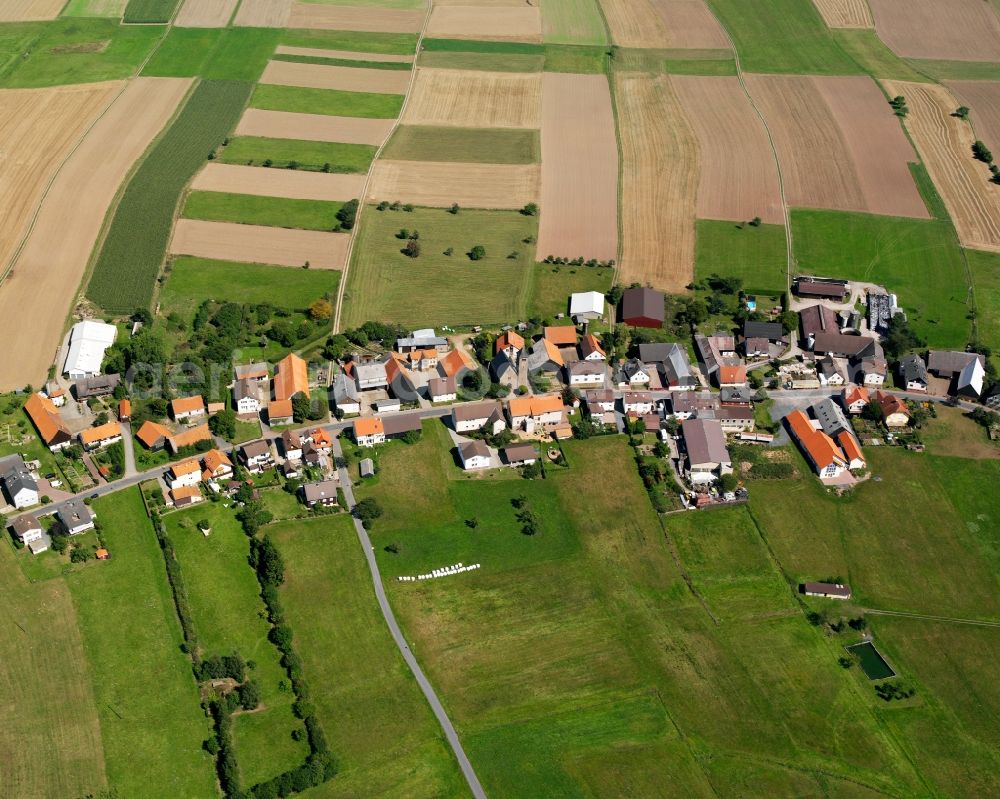 Aerial image Würzberg - Agricultural land and field boundaries surround the settlement area of the village in Würzberg in the state Hesse, Germany