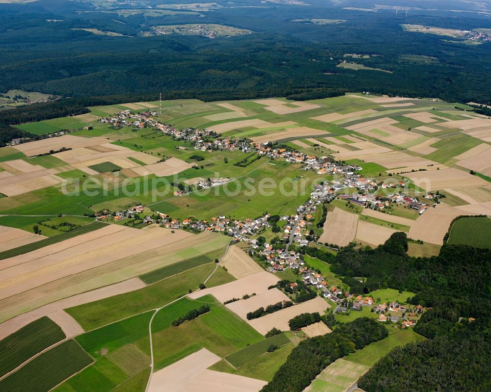 Aerial image Würzberg - Agricultural land and field boundaries surround the settlement area of the village in Würzberg in the state Hesse, Germany