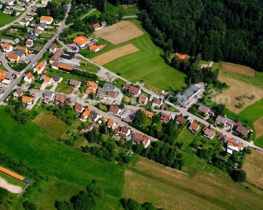 Aerial photograph Wüstenrot - Agricultural land and field boundaries surround the settlement area of the village in Wüstenrot in the state Baden-Wuerttemberg, Germany