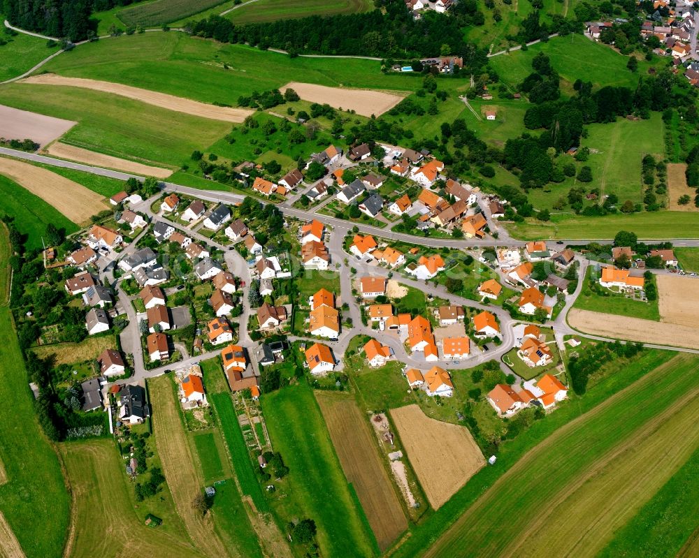 Aerial photograph Wüstenrot - Agricultural land and field boundaries surround the settlement area of the village in Wüstenrot in the state Baden-Wuerttemberg, Germany