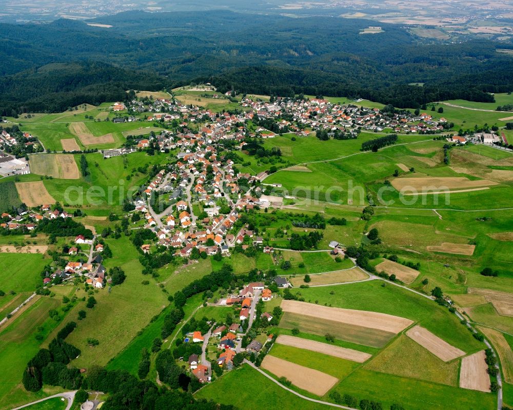 Wüstenrot from above - Agricultural land and field boundaries surround the settlement area of the village in Wüstenrot in the state Baden-Wuerttemberg, Germany