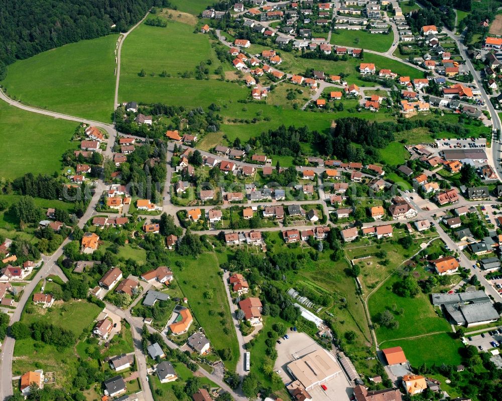 Wüstenrot from above - Agricultural land and field boundaries surround the settlement area of the village in Wüstenrot in the state Baden-Wuerttemberg, Germany