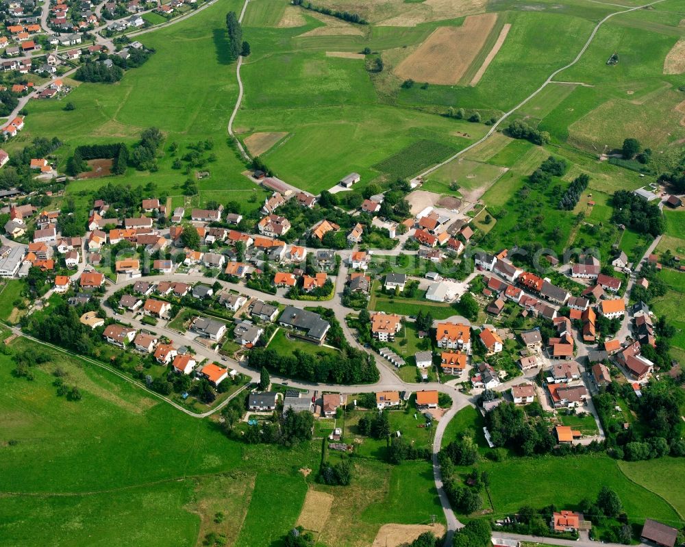 Wüstenrot from above - Agricultural land and field boundaries surround the settlement area of the village in Wüstenrot in the state Baden-Wuerttemberg, Germany