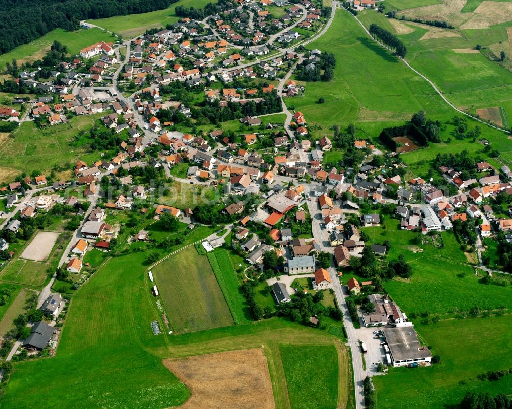 Aerial photograph Wüstenrot - Agricultural land and field boundaries surround the settlement area of the village in Wüstenrot in the state Baden-Wuerttemberg, Germany