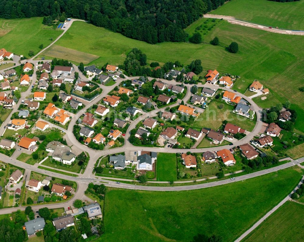 Wüstenrot from above - Agricultural land and field boundaries surround the settlement area of the village in Wüstenrot in the state Baden-Wuerttemberg, Germany