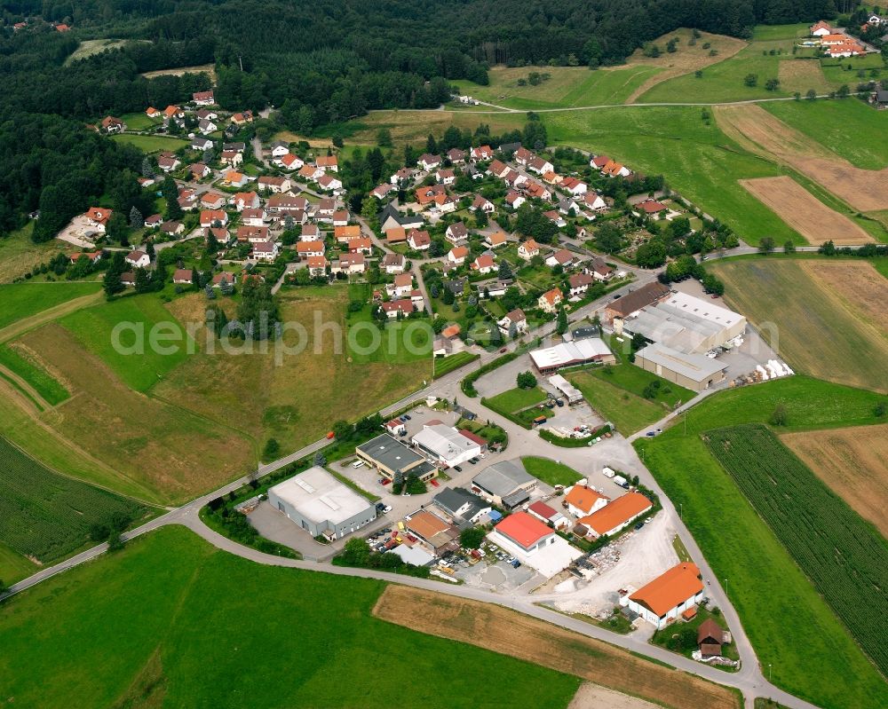 Aerial photograph Wüstenrot - Agricultural land and field boundaries surround the settlement area of the village in Wüstenrot in the state Baden-Wuerttemberg, Germany