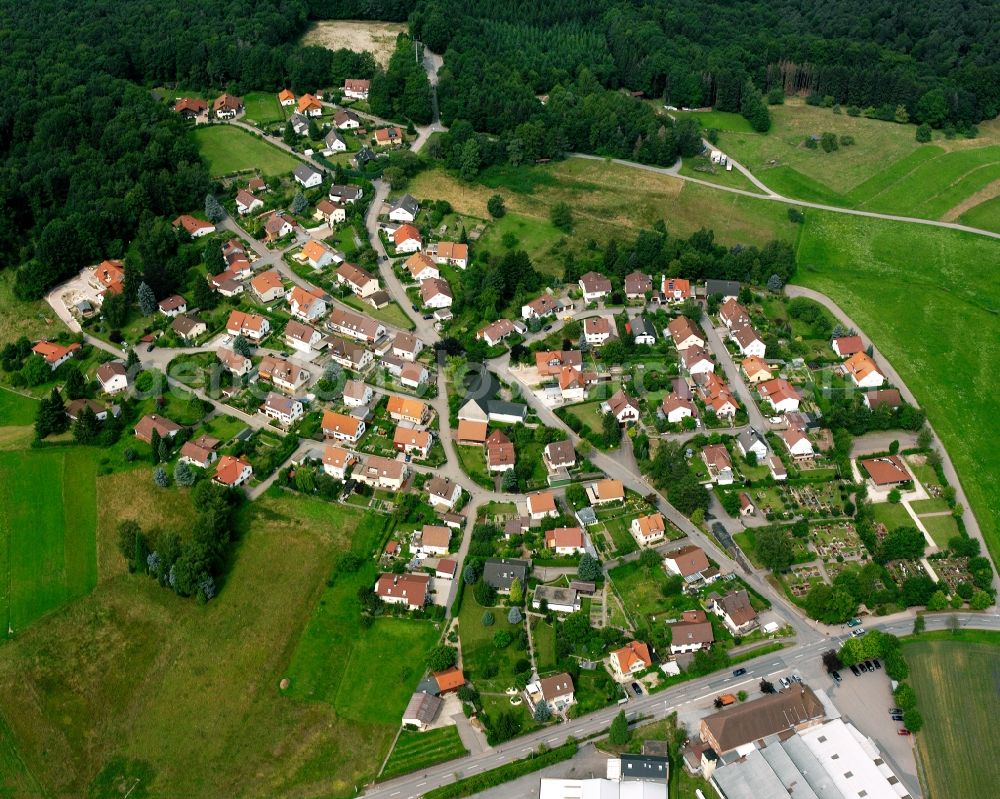 Wüstenrot from the bird's eye view: Agricultural land and field boundaries surround the settlement area of the village in Wüstenrot in the state Baden-Wuerttemberg, Germany