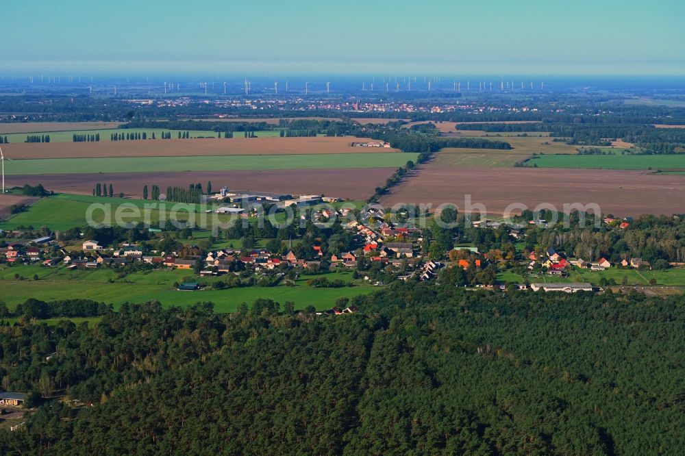 Aerial photograph Wulkow - Agricultural land and field boundaries surround the settlement area of the village in Wulkow in the state Brandenburg, Germany