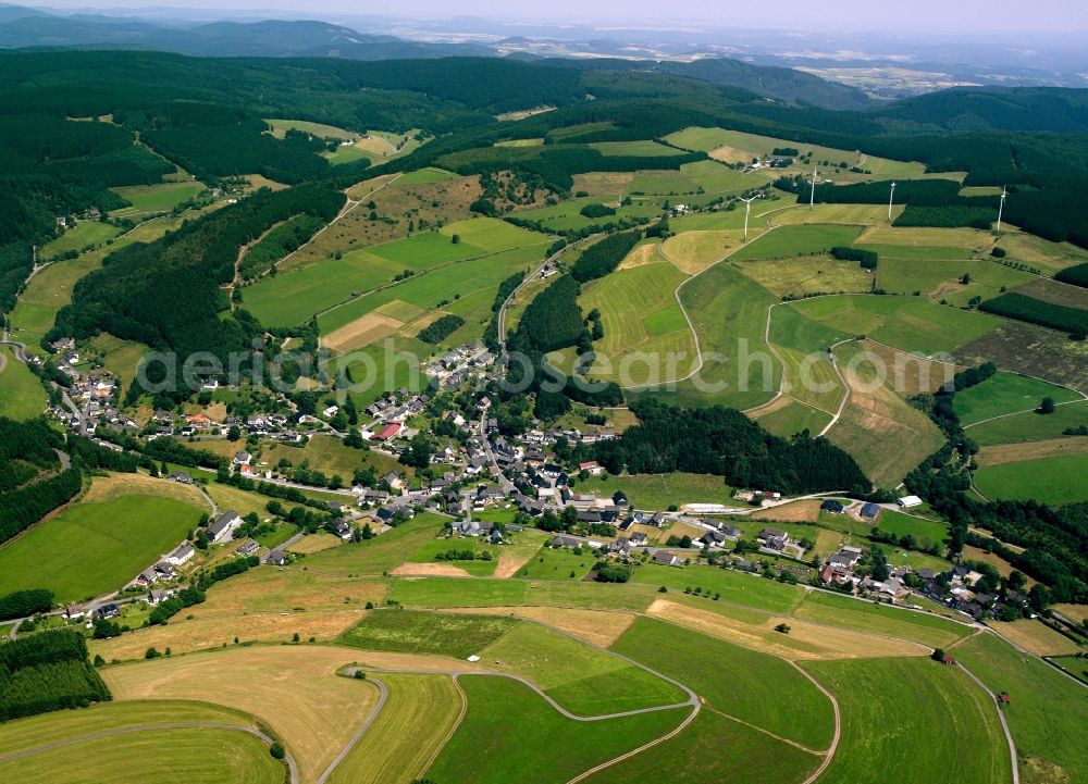 Wunderthausen from above - Agricultural land and field boundaries surround the settlement area of the village in Wunderthausen in the state North Rhine-Westphalia, Germany