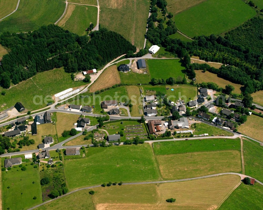 Wunderthausen from the bird's eye view: Agricultural land and field boundaries surround the settlement area of the village in Wunderthausen in the state North Rhine-Westphalia, Germany