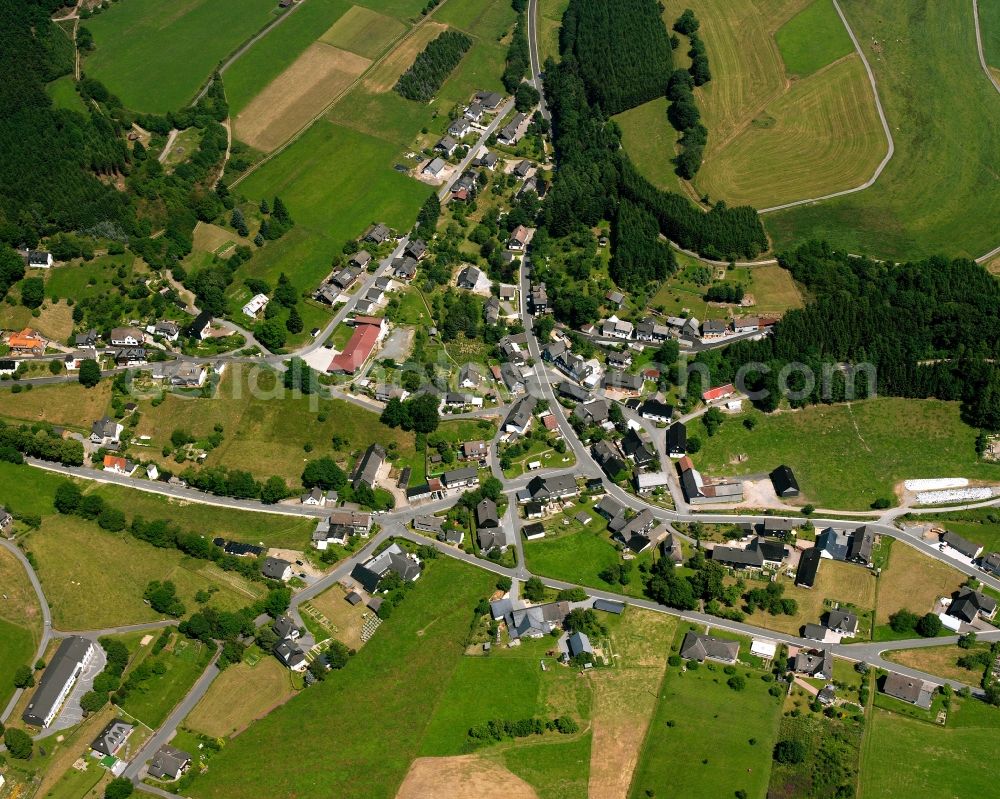 Wunderthausen from above - Agricultural land and field boundaries surround the settlement area of the village in Wunderthausen in the state North Rhine-Westphalia, Germany