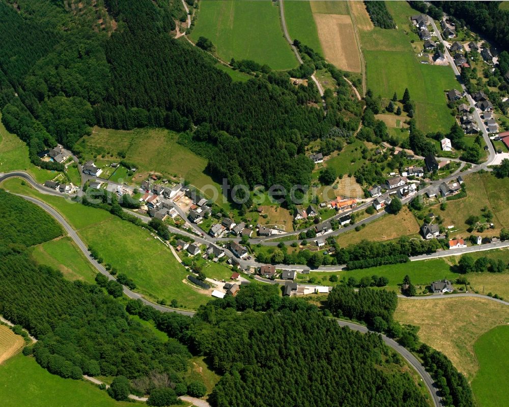 Wunderthausen from the bird's eye view: Agricultural land and field boundaries surround the settlement area of the village in Wunderthausen in the state North Rhine-Westphalia, Germany