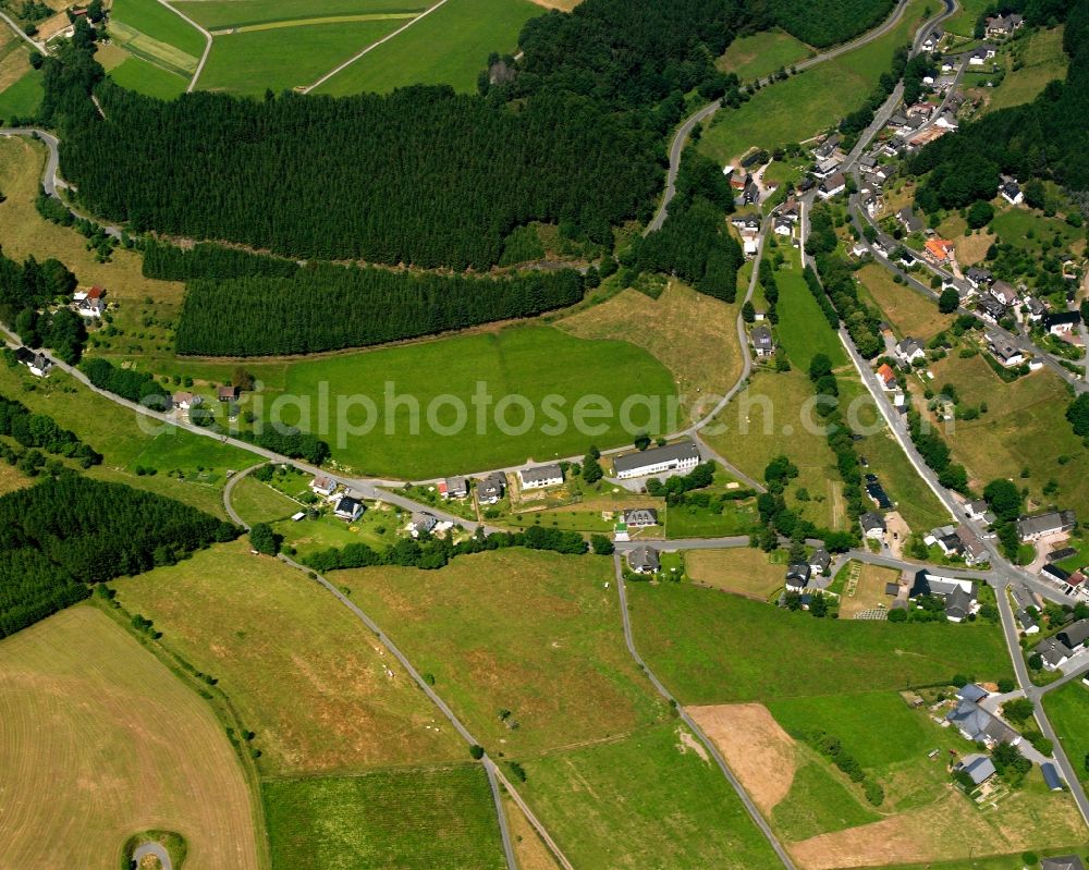 Aerial image Wunderthausen - Agricultural land and field boundaries surround the settlement area of the village in Wunderthausen in the state North Rhine-Westphalia, Germany