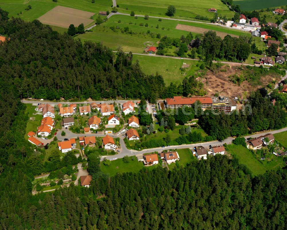 Zavelstein from the bird's eye view: Agricultural land and field boundaries surround the settlement area of the village in Zavelstein in the state Baden-Wuerttemberg, Germany