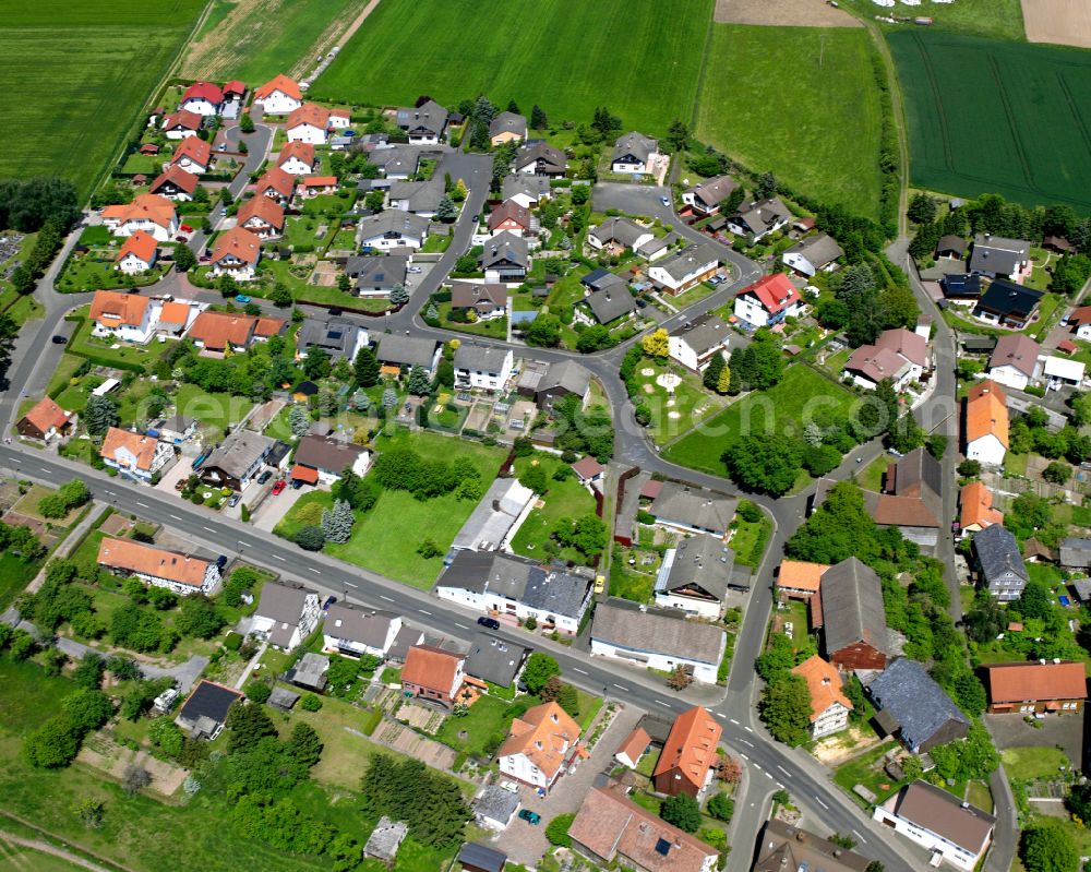 Aerial image Zell - Agricultural land and field boundaries surround the settlement area of the village in Zell in the state Hesse, Germany